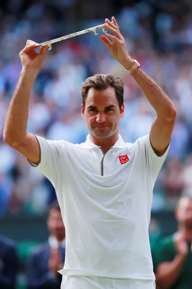 Roger Federer with the runners-up plate