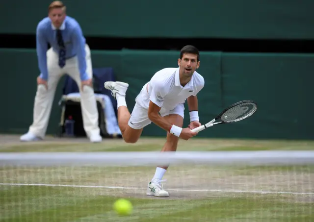 Novak Djokovic serves