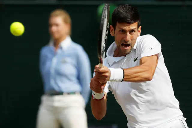 Novak Djokovic with a fierce roar as he hits a passing shot