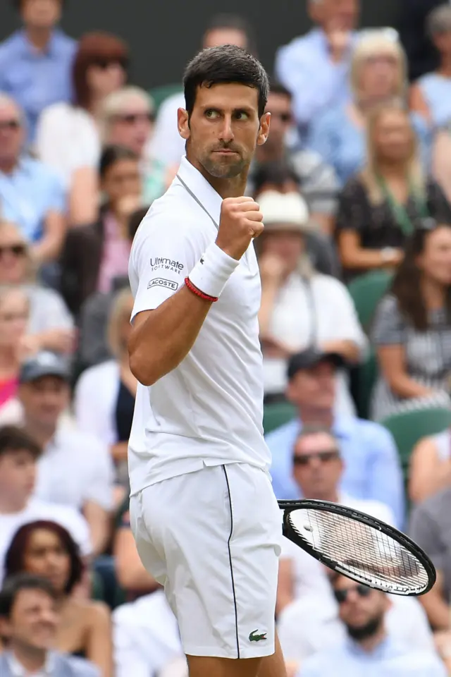 Novak Djokovic celebrates winning the opening set