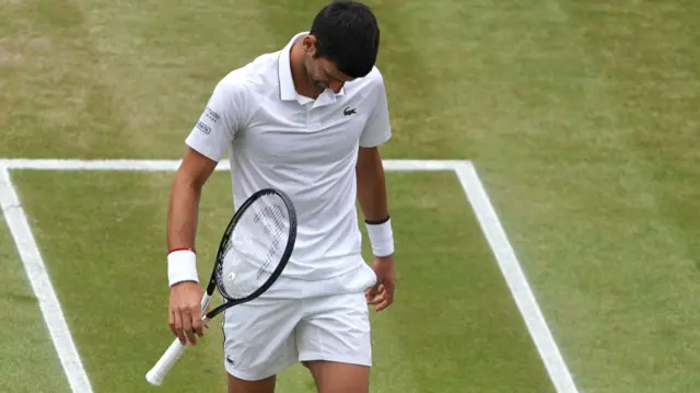 Novak Djokovic looking down