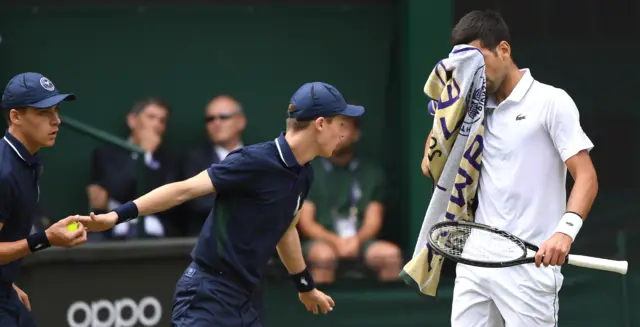 Novak Djokovic towels himself down