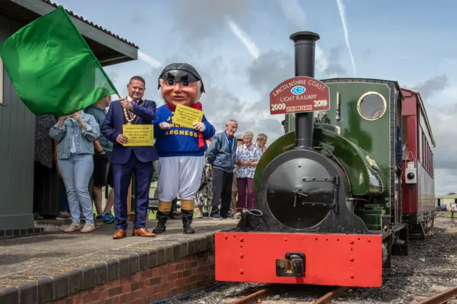 Mayor of Skegness, Councillor Mark Dannatt and Jolly Fisherman with the anniversary train.