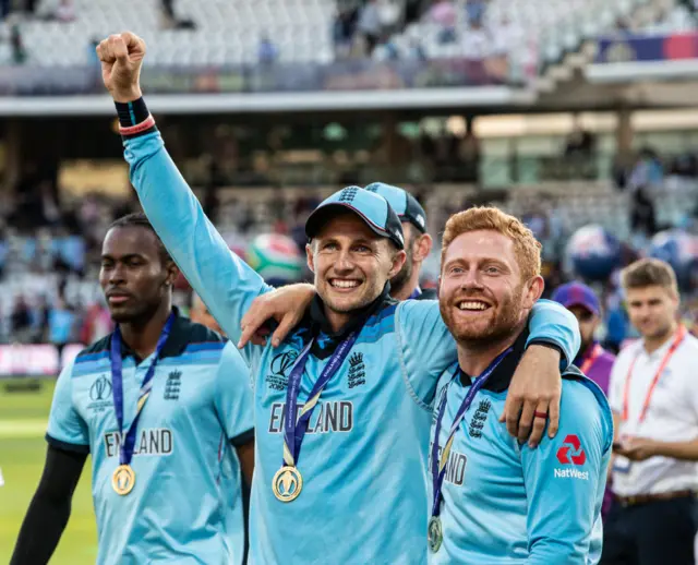 Joe Root (left) and Jonny Bairstow celebrate England's World Cup win arm in arm