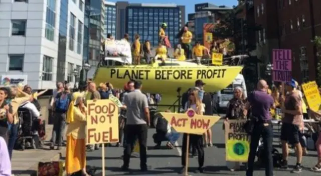 Extinction Rebellion Leeds unveiled a boat on Victoria Bridge