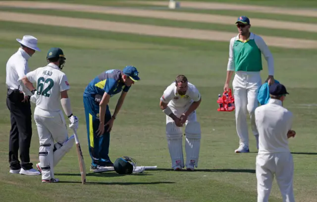 Matthew Wade after being hit by the ball during the Australian XI's match with the England Lions