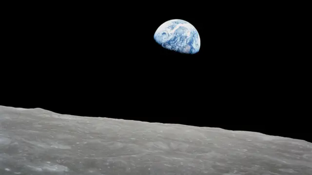 The Earth, rising over the Moon's horizon