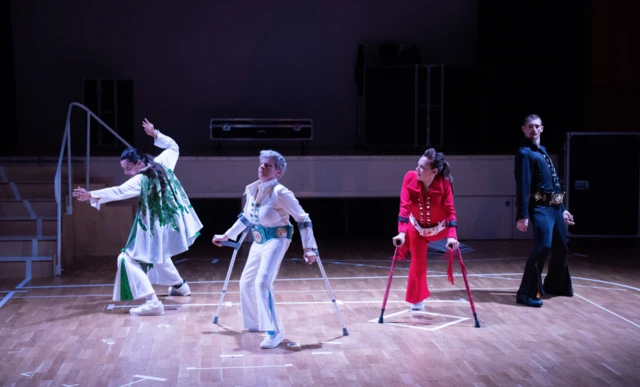 Four performers in tribute artist costume