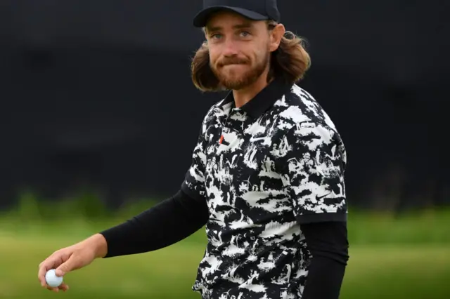 Tommy Fleetwood in a black and white patterned shirt