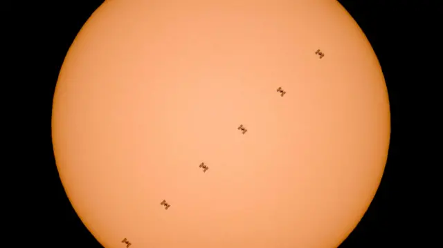 ISS passes in front of the Sun