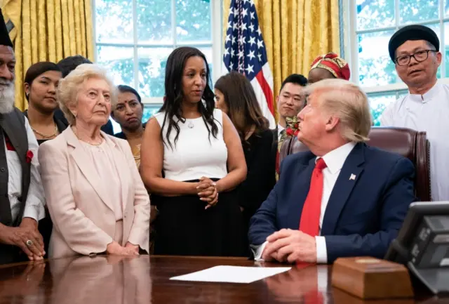 US President Donald J. Trump welcomes survivors of religious persecution to the Oval Office at the White House in Washington