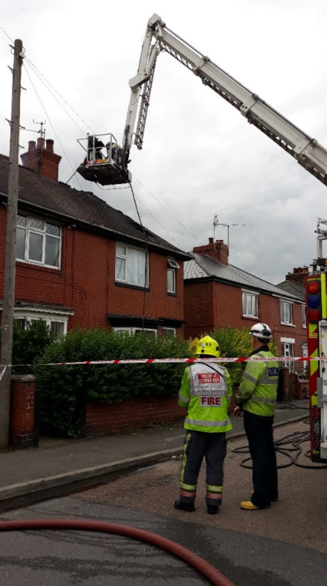 Firefighters outside house