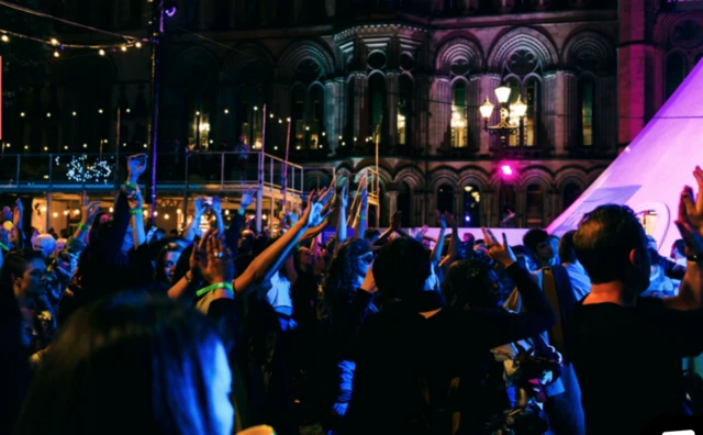 Partygoers enjoy the nightlife of Festival Square