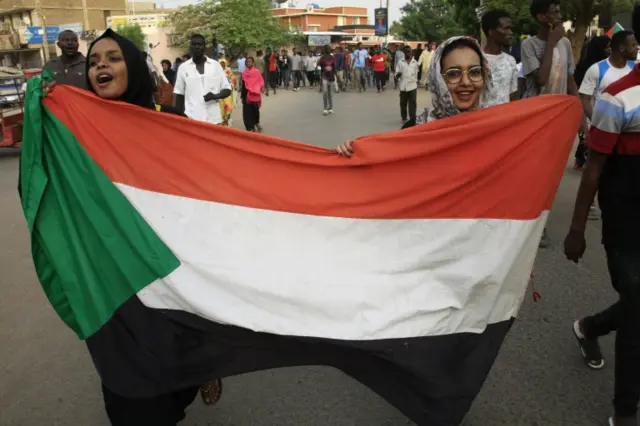 Sudanese women march in the capital Khartoum on Sunday