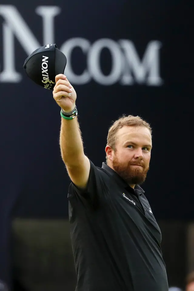 Shane Lowry salutes the spectators on the 18th green