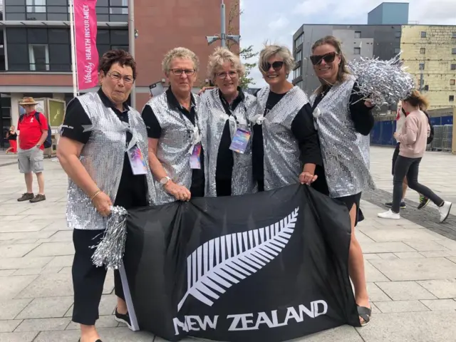 New Zealand fans in sequin waistcoats