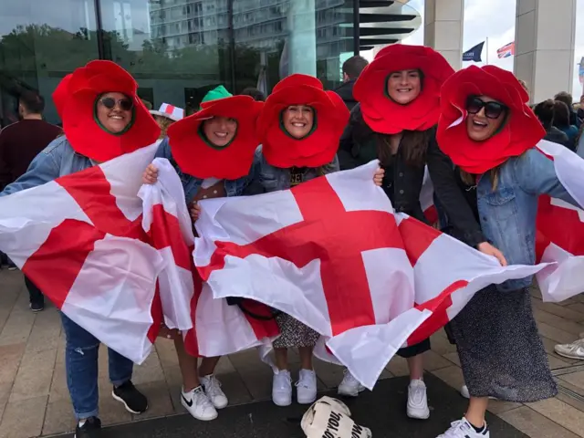 England fans with flags and roses