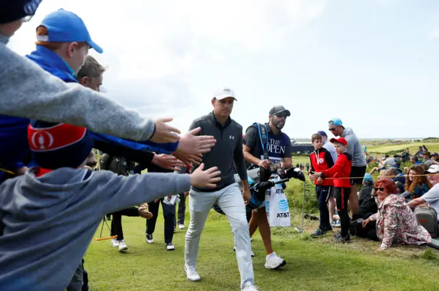 Jordan Spieth walks to the third hole