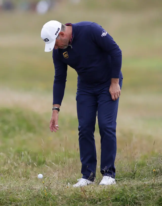 Lee Westwood takes a drop on the 10th hole