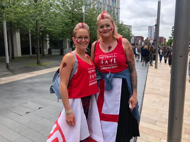 Two fans dressed in England gear