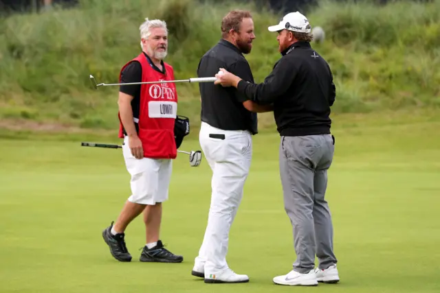 Shane Lowry and JB Holmes on the 18th green