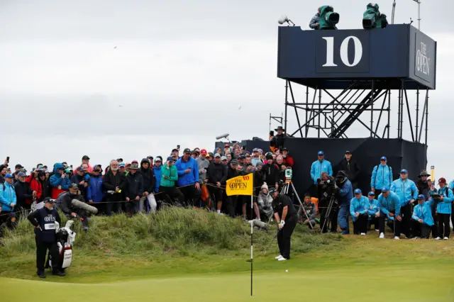 Shane Lowry chips on to the green on the 10th hole