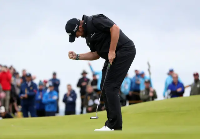 Shane Lowry pumps his fist after a birdie on the 15th