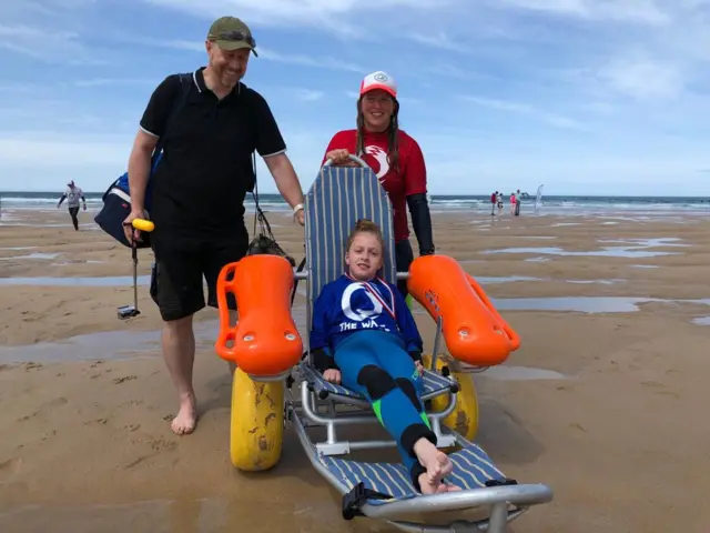 girl in beach wheelchair