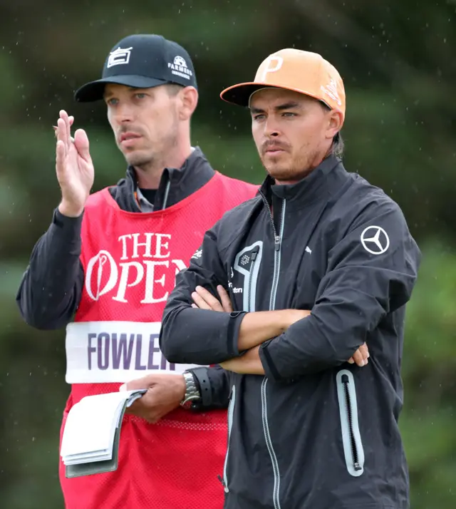 Rickie Fowler and his caddy