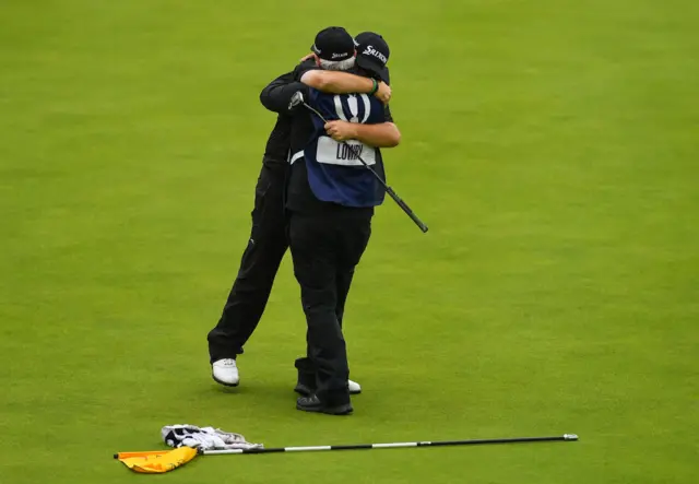 Shane Lowry and caddie