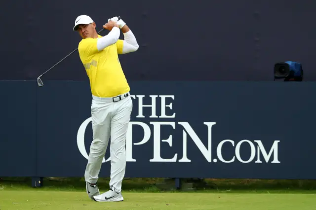 Brooks Koepka takes his tee shot on the first hole