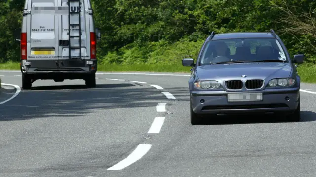 A file photo of a car driving on a road