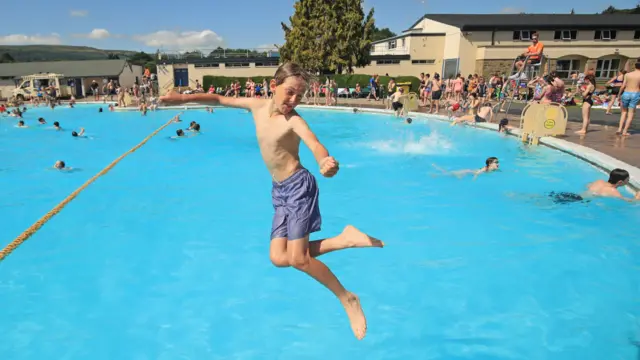 A child jumps into the water