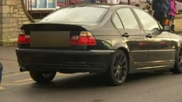 A car parked near a school