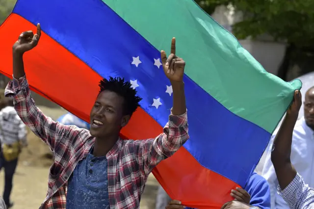 Sidama campaigner with a flag