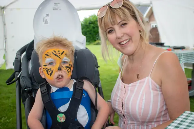 Mother and son with face paint