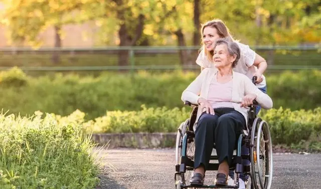 Lady with dementia and carer