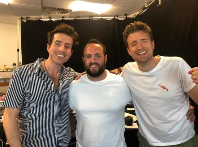 Radio 1 DJs Nick Grimshaw and Greg James with a listener