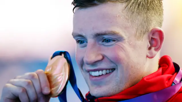 Adam Peaty with gold medal