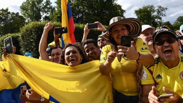 Colombian fans celebrate prior to the 21st and last stage of the 106th Tour de France