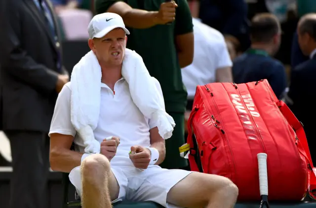 Kyle Edmund shows the pain on his face during the change of ends