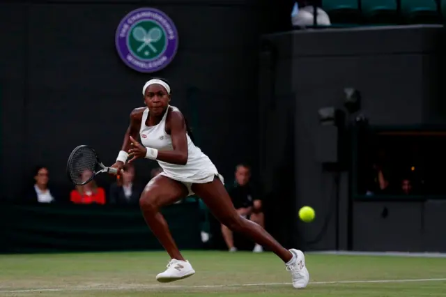 Coco Gauff runs for the ball