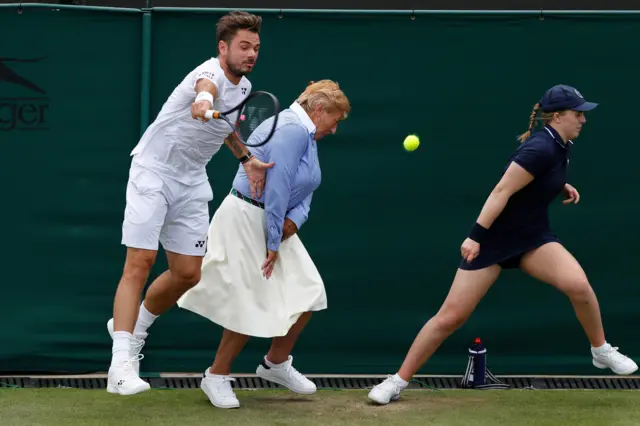 Stan Wawrinka collides with a line judge