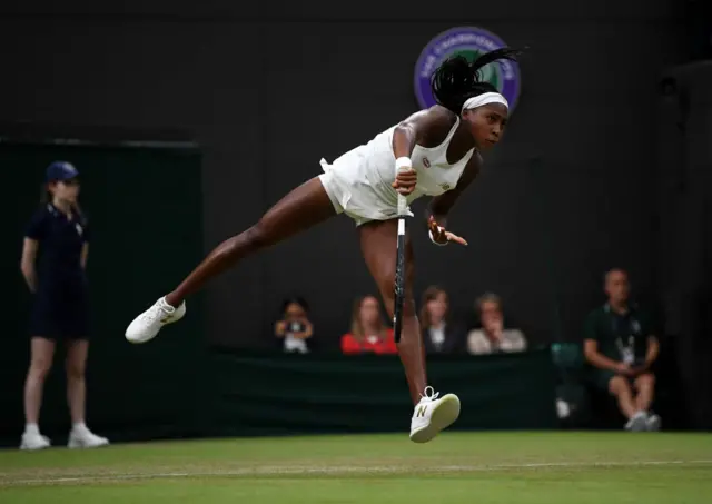 Coco Gauff serves