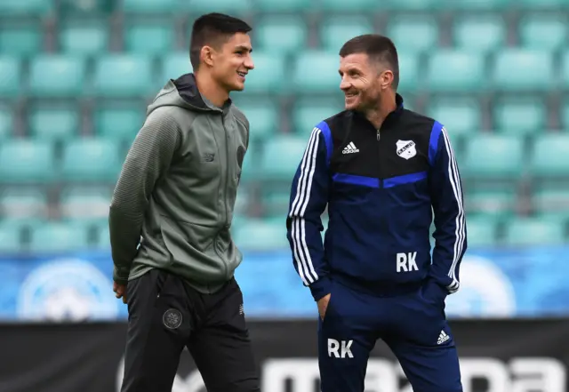 Celtic's Marian Shved (left) has a pre-match word with Nomme Kalju manager Roman Kozhukhovskyi