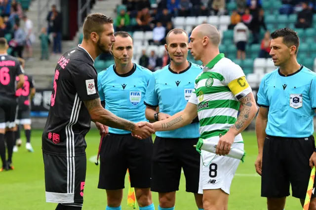 The captains shake hands prior to kick off in Tallinn