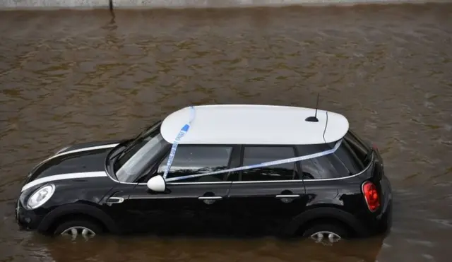 cAR SUBMERGED IN WATER