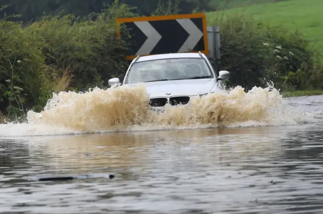 Car driving in flood water