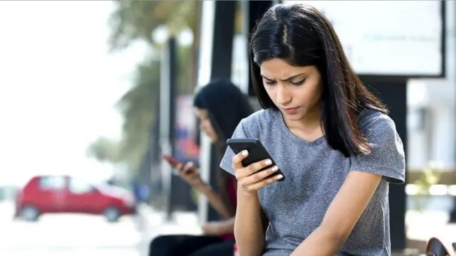 Woman using phone - generic image