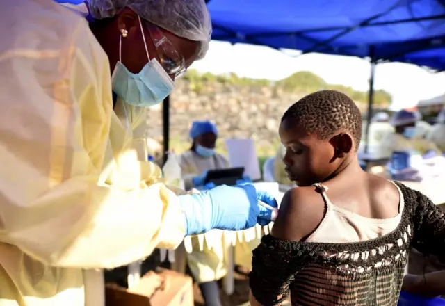 A Congolese health worker administers ebola vaccine to a child at the Himbi Health Centre in Goma, Democratic Republic of Congo, July 17, 2019.